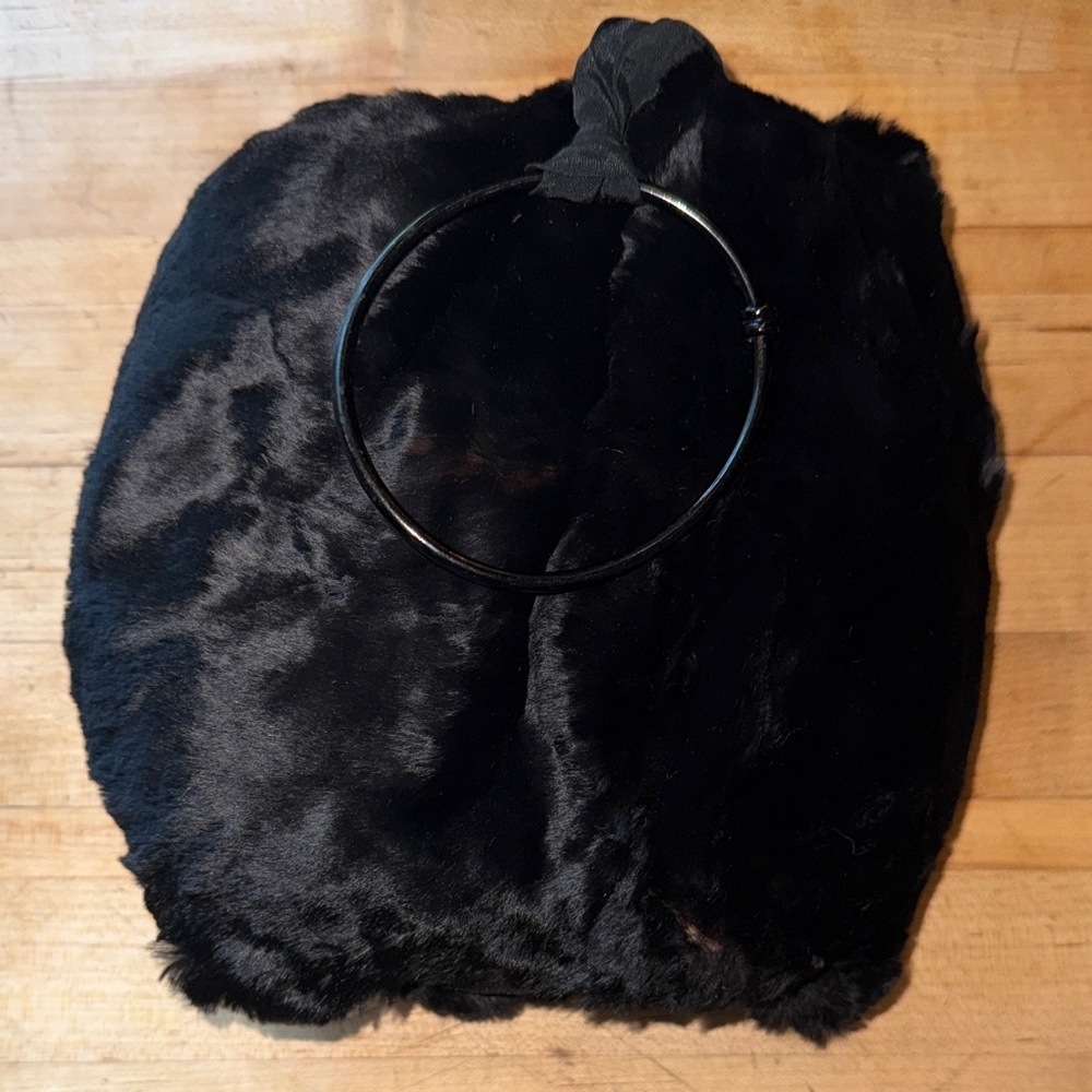 Vintage child’s seal fur muff hand warmer in black.